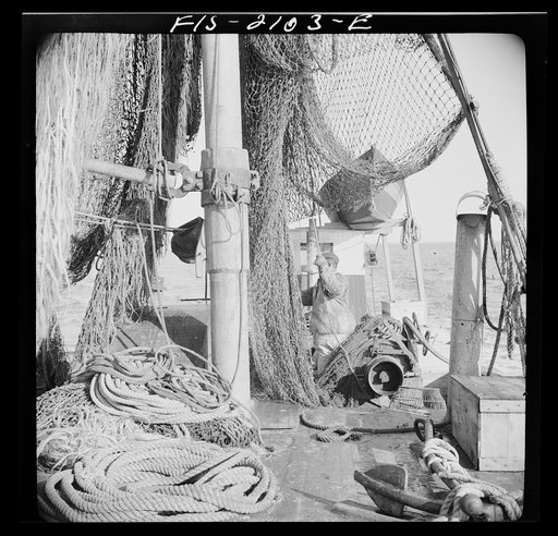 Provincetown, Massachusetts. Aboard the Frances and Marion, a Portuguese drag trawler, fishing off Cape Cod. Homeward bound from the banks, the drag nets are hoisted aloft to dry