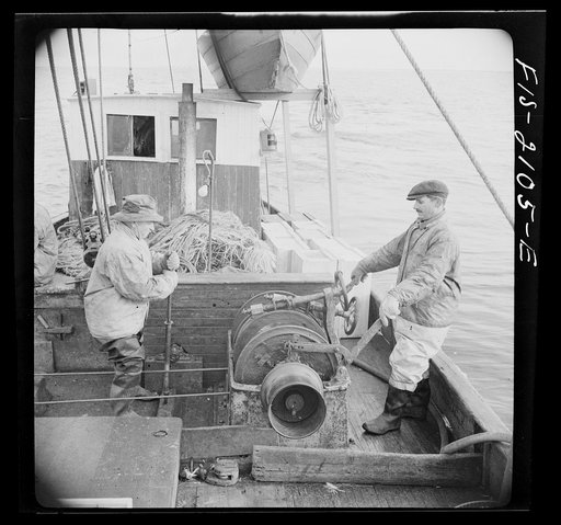 Untitled photo, possibly related to: Provincetown, Massachusetts. Aboard the Frances and Marion, a Portuguese drag trawler, fishing off Cape Cod. Winchman hauling in the trawl