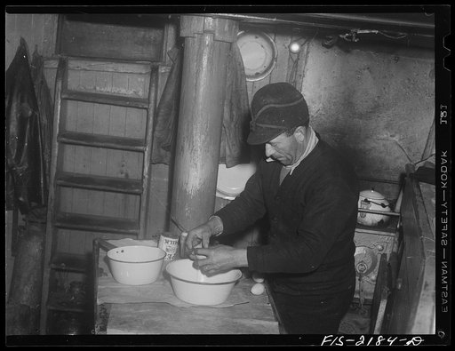 Provincetown, Massachusetts. Getting breakfast aboard the Portuguese trawler, Frances and Marion