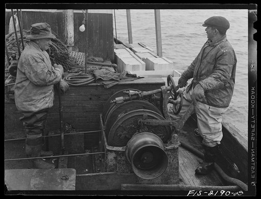 Untitled photo, possibly related to: Provincetown, Massachusetts. Portuguese fisherman manning the winch which hauls in the trawl
