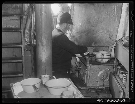 Provincetown, Massachusetts. Getting breakfast aboard the Portuguese trawler Frances and Marion