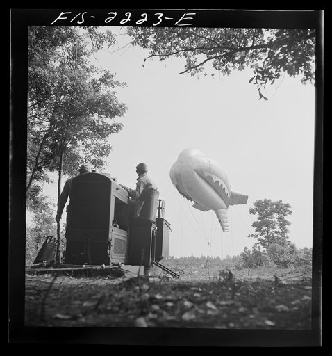 Untitled photo, possibly related to: Parris Island, South Carolina. Tactical formations of barrage balloons prevent dive bombing and the strafing of important ground installations. The Leathernecks are developing an excellent technique in this method of protecting important locations from enemy airc