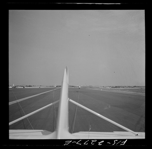 Untitled photo, possibly related to: Parris Island, South Carolina. U.S. Marine Corps glider detachment training camp. An aerial "tug boat" tows three gliders high above the field