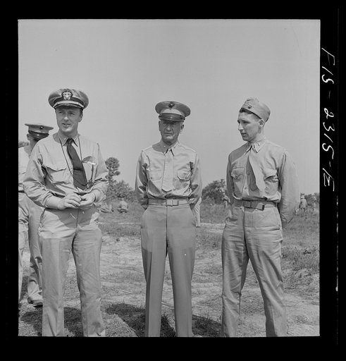 Parris Island, South Carolina. Brigadier General Emile Moses talking with a Marine Corps lieutenant and a Navy lieutenant at the U.S. Marines Corps glider detachment training camp