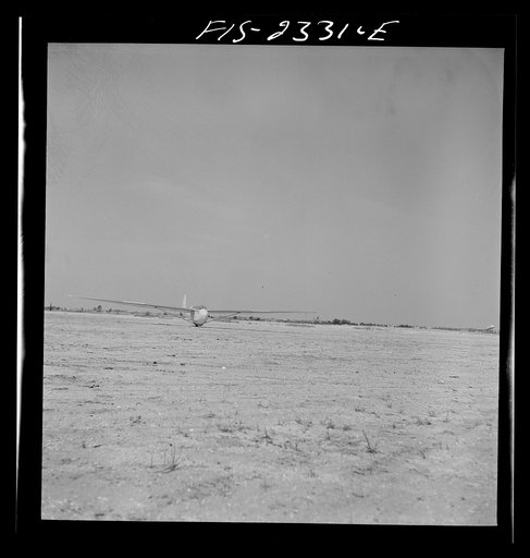 Untitled photo, possibly related to: Parris Island, South Carolina. A glider plane being towed over a field at the U.S. Marine Corps glider detachment training camp