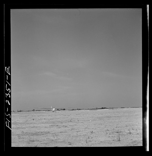 Untitled photo, possibly related to: Parris Island, South Carolina. A glider plane being towed over a field at the U.S. Marine Corps glider detachment training camp
