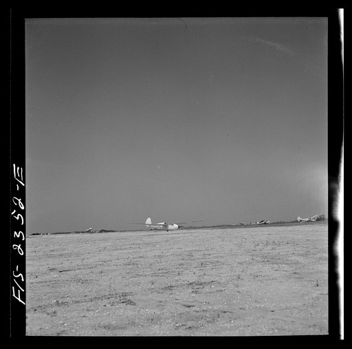 Untitled photo, possibly related to: Parris Island, South Carolina. A glider plane being towed over a field at the U.S. Marine Corps glider detachment training camp