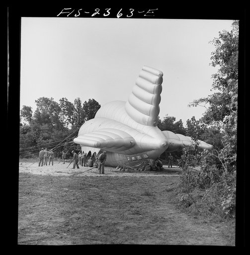 Parris Island, South Carolina. Special United States Marine units in training bedding down a big barrage balloon