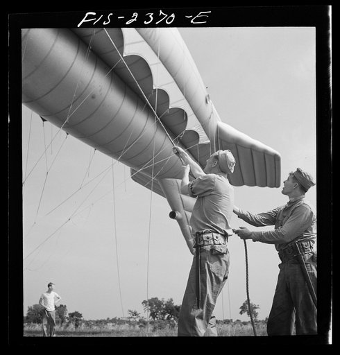 Parris Island, South Carolina. U.S. Marine Corps glider detachment training camp. A barrage balloon takes to the air under capable handling by a Marine Corps ground crew