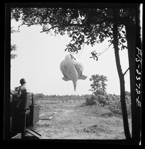 Untitled photo, possibly related to: Parris Island, South Carolina. Tactical formations of barrage balloons prevent dive bombing and the strafing of important ground installations. The Leathernecks are developing an excellent technique in this method of protecting important locations from enemy airc