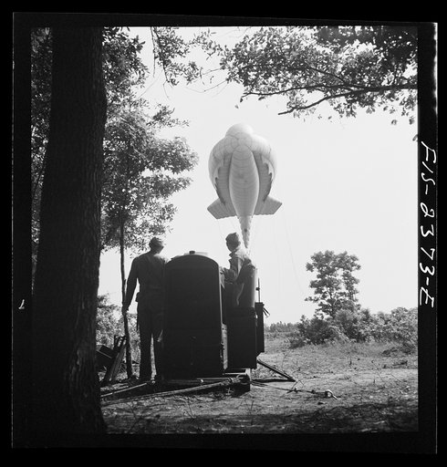 Untitled photo, possibly related to: Parris Island, South Carolina. Tactical formations of barrage balloons prevent dive bombing and the strafing of important ground installations. The Leathernecks are developing an excellent technique in this method of protecting important locations from enemy airc