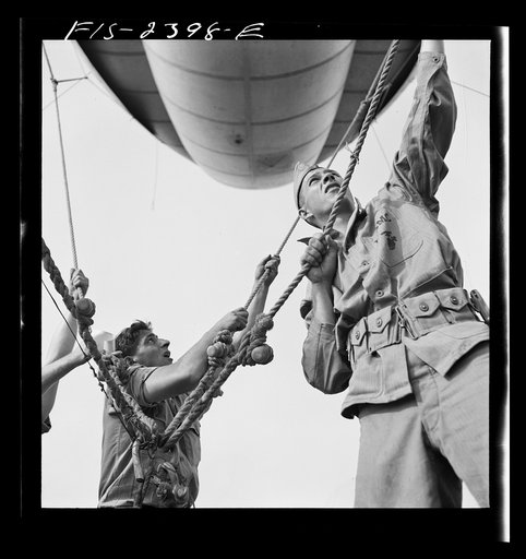 Parris Island, South Carolina. U.S. Marine Corps glider detachment training camp. A barrage balloon takes to the air under capable handling by a Marine Corps ground crew