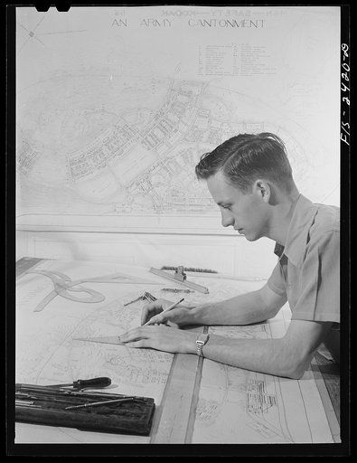 Robert Scannell, of Randalia, Iowa, a senior in Landscape Architecture, working on plans for an army cantonment. Iowa State College. Ames, Iowa