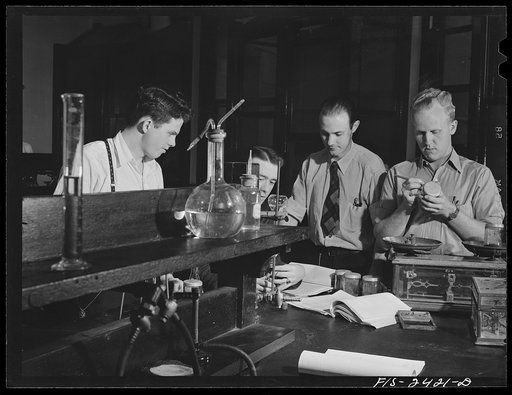 Left to right: Ronald Wodin, a junior; Rex Taylor, junior; Professor Charles Black; Wayne Strong, a senior working in soils laboratory at Iowa State College. Ames, Iowa