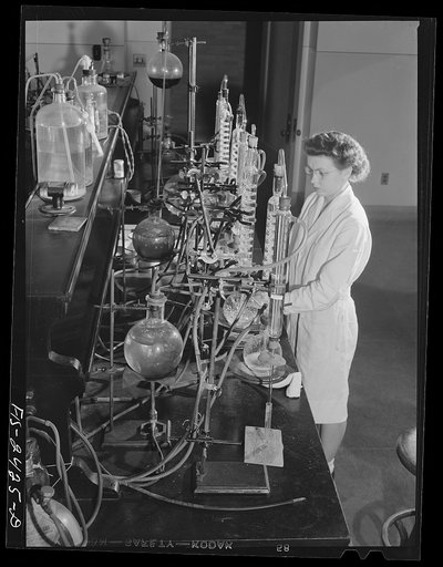 Miss Jeanne Dougherty, graduate in Bacteriology, working in the laboratory in the Dairy Industry Department. She is conducting experiments on the effect of acids on the flavor of butter. Iowa State College. Ames, Iowa