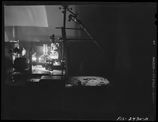 Untitled photo, possibly related to: Part of a micro-projection setup used by Professor Peterson of the Soils and Agronomy Department used in studying soil structure. The emulsified soil particles are in the glass container under the microscope. Iowa State College. Ames, Iowa