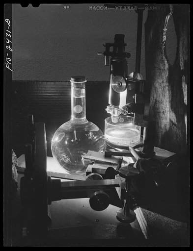 Part of a micro-projection setup used by Professor Peterson of the Soils and Agronomy Department used in studying soil structure. The emulsified soil particles are in the glass container under the microscope. Iowa State College. Ames, Iowa
