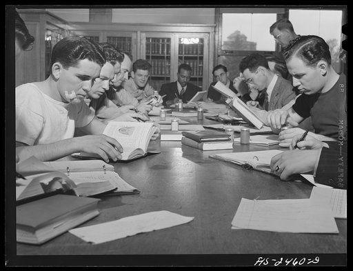Untitled photo, possibly related to: Professor A.L. Anderson's class of seniors in pork production. Students are making a study of feed samples and are all majoring in Animal Husbandry. Iowa State College. Ames, Iowa