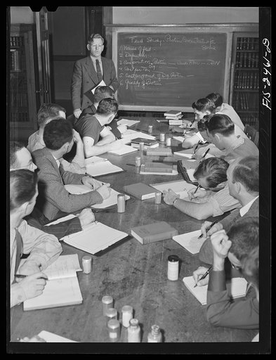 Seniors in Animal Husbandry in a class in pork production. They are studying feed samples. Class led by Professor A.L. Anderson. Iowa State College. Ames, Iowa
