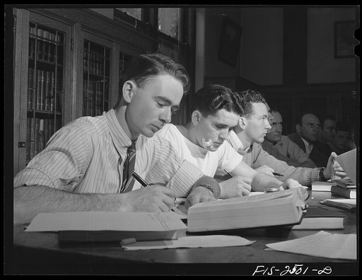 Dale Goodell, twenty-two, in foreground, is a senior majoring in Animal Husbandry, from a farm near Estherville, Iowa. In Professor A.H. Anderson's class in pork production, Iowa State College. Ames, Iowa