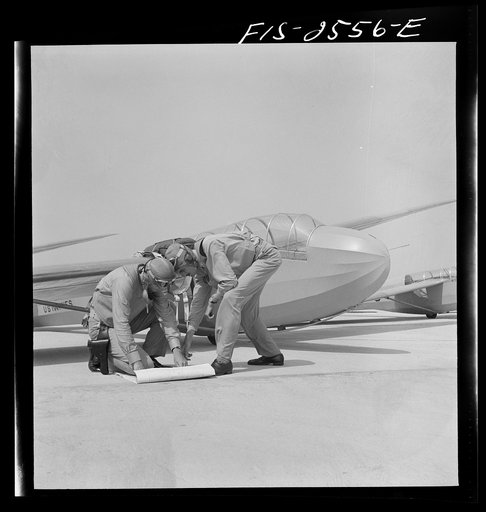 Parris Island, South Carolina.  Lieutenants of Marine Corps, studying glider pilotage, compare notes before a flight