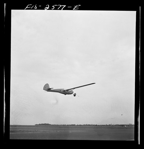 Untitled photo, possibly related to: Parris Island, South Carolina. A glider plane being towed over a field at the U.S. Marine Corps glider detachment training camp