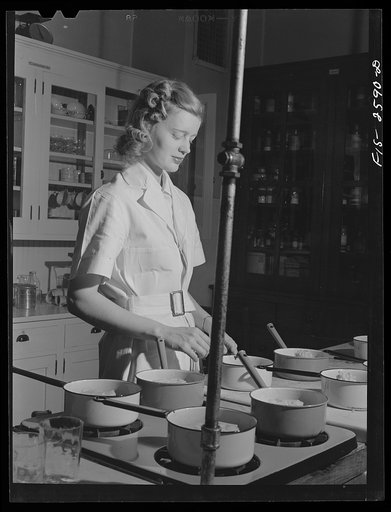 Helen L. Hanson, research assistant, working on problems connected with frozen foods. In the Home Economics Department at Iowa State College. Ames, Iowa