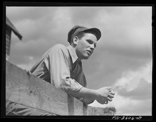 Gene Cooper, student at Iowa State College visits his family on their farm near Ames, Iowa