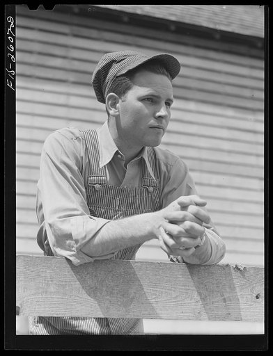 Gene Cooper, student at Iowa State College visits his family on their farm near Ames, Iowa