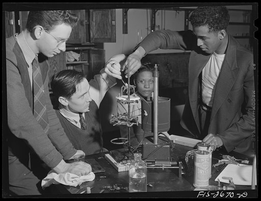 Untitled photo, possibly related to: Postgraduate students studying physiology of the muscle. The experiment is with frogs' muscle tissue. Left to right: 1) J.S. Newcomer, graduate of University of Utah and majoring in organic chemistry. 2) A.E. Bell, graduate of University of Kentucky, genetics maj