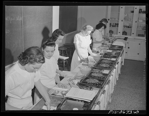 A class in food preparation in the home economics department at Iowa State College. Ames, Iowa