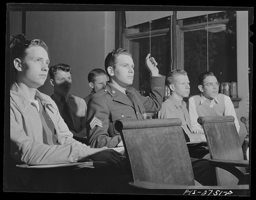 Gene has Reserve Officers' Training Corps (ROTC) classes later in the day, so he wears his uniform all day long. This is an agronomy class in agricultural hall. Iowa State College, Ames, Iowa