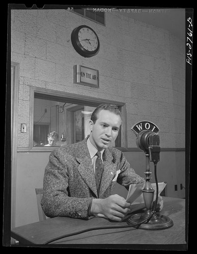 Don Jackson, a senior, delivering a news broadcast at the Iowa State College radio station. Jackson comes from a farm in Iowa. Recently won honorable mention in a nationwide contest sponsored by Dodd, Meade and Company for a book he wrote and which they published. He lost a brother in the Pearl Harb