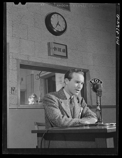 Untitled photo, possibly related to: Don Jackson, a senior, delivering a news broadcast at the Iowa State College radio station. Jackson comes from a farm in Iowa. Recently won honorable mention in a nationwide contest sponsored by Dodd, Meade and Company for a book he wrote and which they published