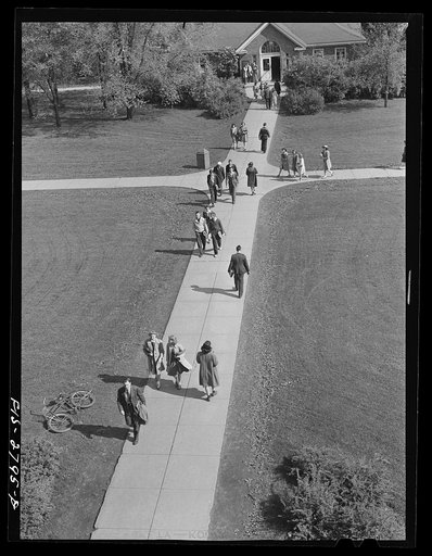 On the campus between classes at Iowa State College. Ames, Iowa