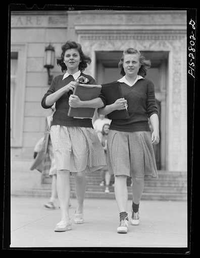 Students coming out of the library at Iowa State College. Ames, Iowa