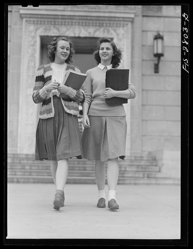 Untitled photo, possibly related to: Students coming out of the library at Iowa State College. Ames, Iowa