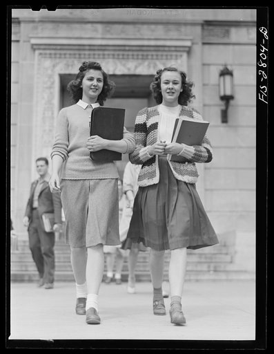 Students coming out of the library at Iowa State College. Ames, Iowa
