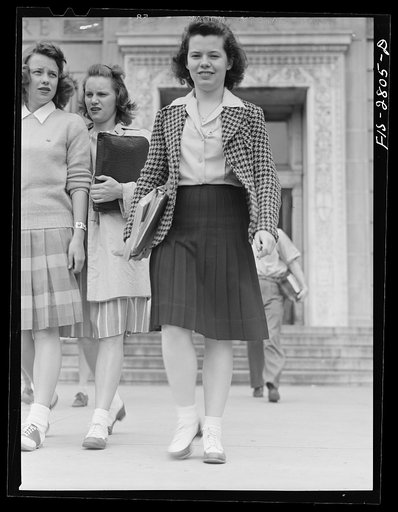 Untitled photo, possibly related to: Students coming out of the library at Iowa State College. Ames, Iowa