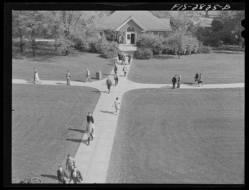 On the campus between classes at Iowa State College. Ames, Iowa