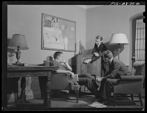 Untitled photo, possibly related to: George Breckenridge, left, forestry student, from Chicago, Illinois, Michael Deane (at radio), general agriculture, from Buenos Aires, Argentina, and Gene Bopp, poultry husbandry, from Fergus Fall, Minnesota listening to latest news reports in the lounge of the m