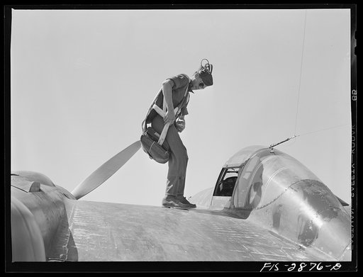 Untitled photo, possibly related to: Lake Muroc, California. One of the Flying Sergeants seated in his plane just before taking off