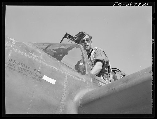 Lake Muroc, California. One of the Flying Sergeants seated in his plane just before taking off