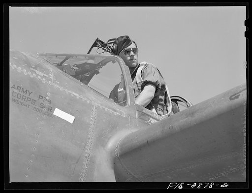 Lake Muroc, California. One of the Flying Sergeants seated in his plane just before taking off