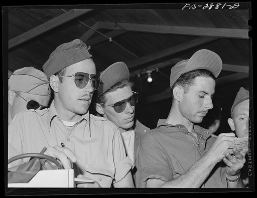 A lieutenant (left front) with members of his flight. He leads some of the "Flying Sergeants" in his flight. Lake Muroc, California