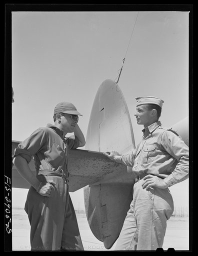 One of the "Flying Sergeants" talks with his lieutenant instructor at Lake Muroc, California