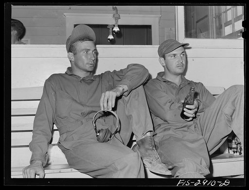 Untitled photo, possibly related to: Two of the "Flying Sergeants" at the post exchange. Lake Muroc, California