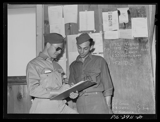 Untitled photo, possibly related to:  Operations department of pursuit squadron. These men take care of records and of other details necessary for operation of the pursuit squadron. Lake Muroc, California