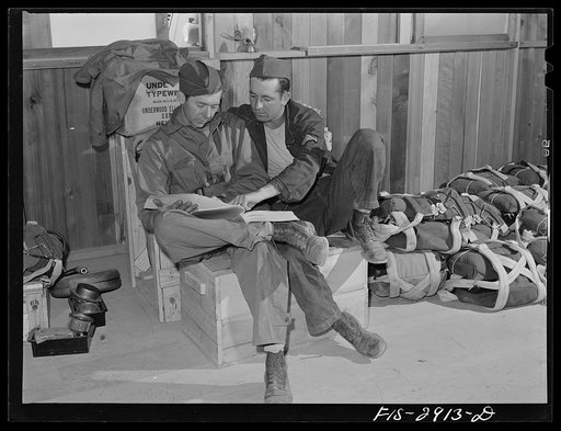 Untitled photo, possibly related to: Magazines and reading matter of all kinds are definitely appreciated by the "Flying Sergeants." Lake Muroc, California
