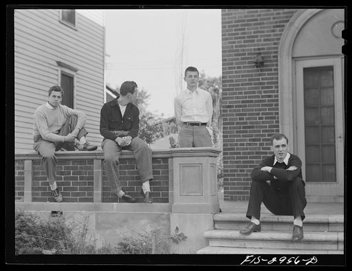 John Cockle (right) with his fraternity brothers on the porch of the Beta Theta Pi house. University of Nebraska, Lincoln
